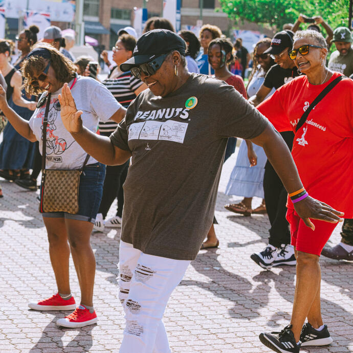 A group of women line dancing