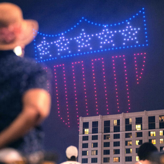 The All-America City shield lighting up the sky during the drone show