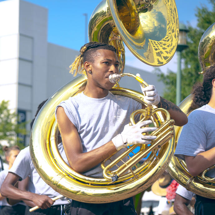 Heritage High School student playing the sousaphone