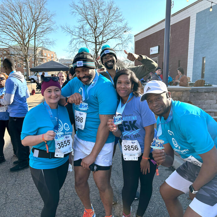 Maritime 5k runners posing after finishing the race