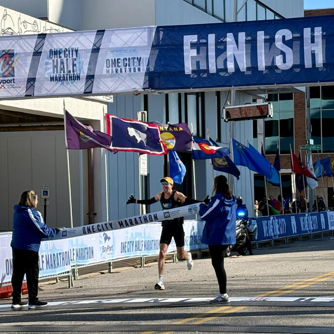 One City Marathon runner runs through the finish line