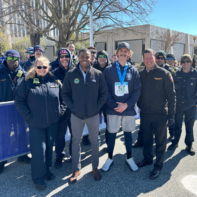 Mayor Phillip Jones posing with members of the Fire Department