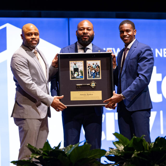 Mayor Jones and Councilman Harris presenting Antoine Bethea with a key to the City