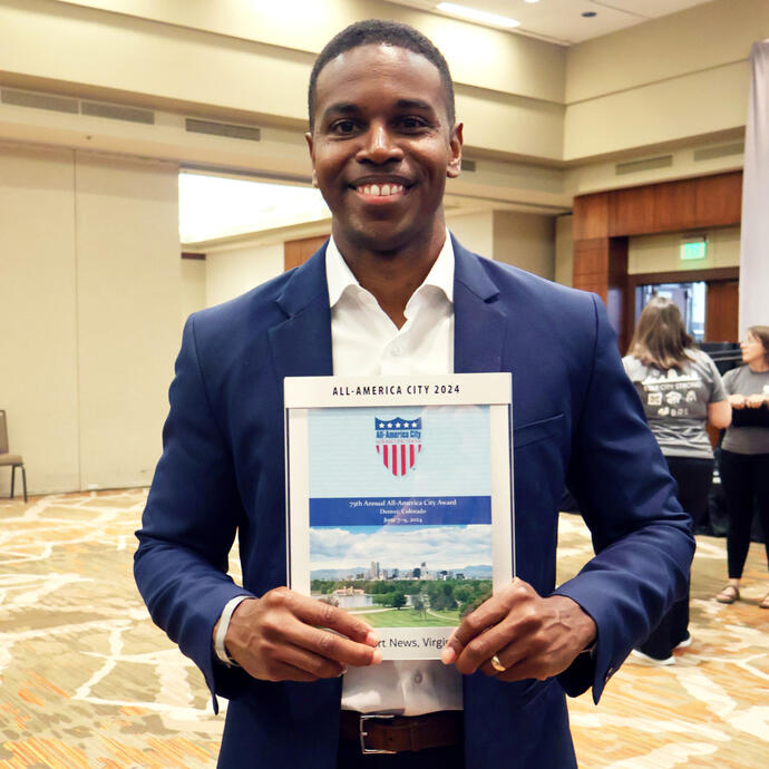 Mayor Jones holding All-America City award